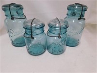 4 blue glass Ball jars. Numbers 1, 4, 9, and 10.