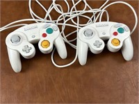 Two Nintendo Game Cube Controllers