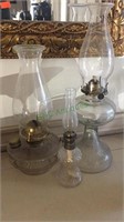 3 antique clear glass oil lamps, one miniature 9