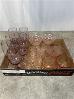 Assortment of pink colored glasses, sugar and