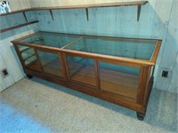 Heavy glass display cabinet located off-site