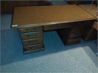 Heavy wooden desk located off-site bring help
