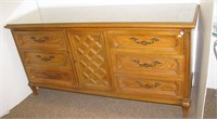 Thomasville nine drawer dresser with glass top.