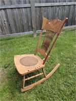 Wooden rocking chair. A bit rough, no arm rests