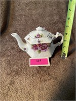 Ivory teapot with purple flowers