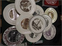10 souvenir plates, mostly of churches