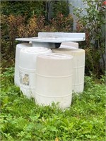 7 plastic white 55 gallon drums & sink