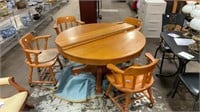 Vintage wooden table w/ 4 chairs on wheels