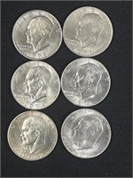 Six Eisenhower dollars two 1971, two one 1974,