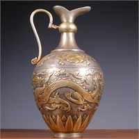 Previously, a silver gilded teapot