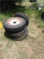 (4) 750/16 mud grip tires mounted on 16" split rim