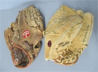 (2) Vintage baseball mitts.