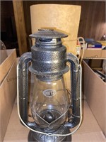 Dietz lantern and small roll of veneer