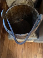 Vintage wooden bucket with iron handle