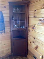 Corner cabinet with glass door. Approximately 77”