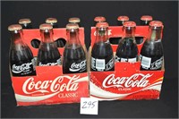 2 cases of full Coca-Cola bottles 1 case is 50th