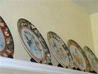 Nine Hand Painted Plates