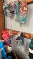 Misc water bottles hanging on wall