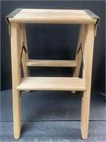 Wooden two-step ladder.