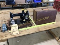 Vintage Deluxe electric sewing machine in carry