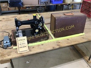 Vintage Deluxe electric sewing machine in carry