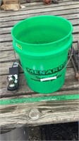 Bucket with chains and 2” ball hitch attachment.