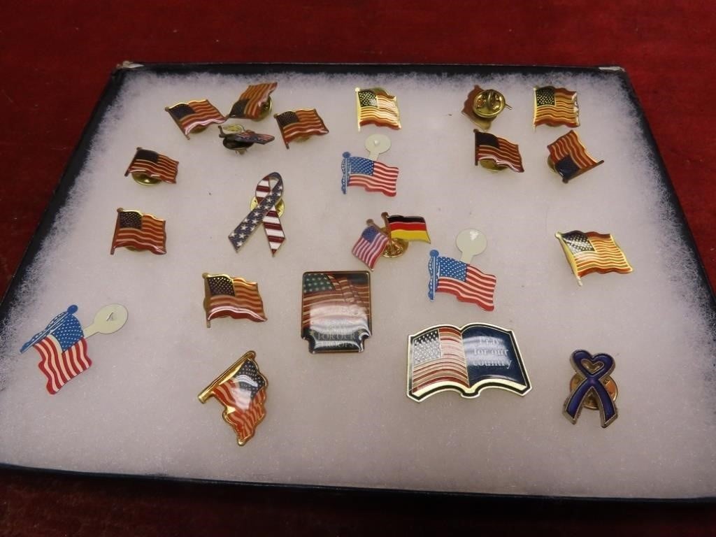 Showcase of American flag lapel pin collection.