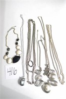 Lot of 7 Silver toned necklaces - ladybug opens
