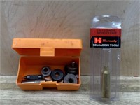 Small box of shell holders and parts and Hornady