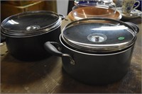 2 black cooking pots