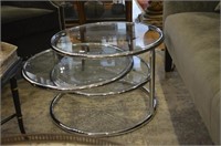 Revolving chrome and glass circular side table