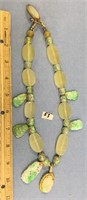 Beautiful necklace with 7 carved jade pendants