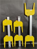3 Yellow Metal Extension Cord Storage Bars