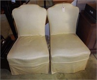 Pair of yellow slip covered side chairs