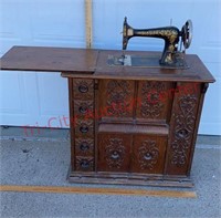 Antique Singer Sewing Machine in Ornate Cabinet