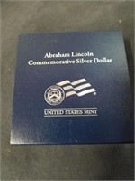 Abraham Lincoln commemorative silver dollar in