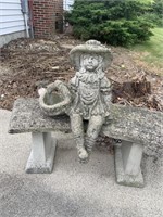 Concrete girl sitting on bench