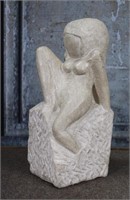 A Mid Century Modern Sculpture of a seated nude