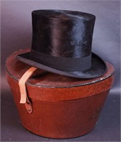 A man's top hat in box marked Knox 5th Avenue,