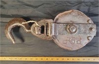 Large rustic farm pulley