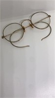 Old gold-rimmed bifocal glasses marked 1/10 12KGF