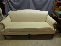 White parlor sofa with claw feet