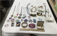 Costume jewelry lot w/ pins, necklaces & bracelets