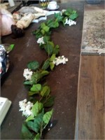 Lot of artificial flowers! Comes with a long