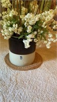 3 gallon crock filled with decorative faux plant,