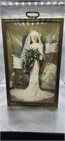 antique photo of bride in bowed glass frame