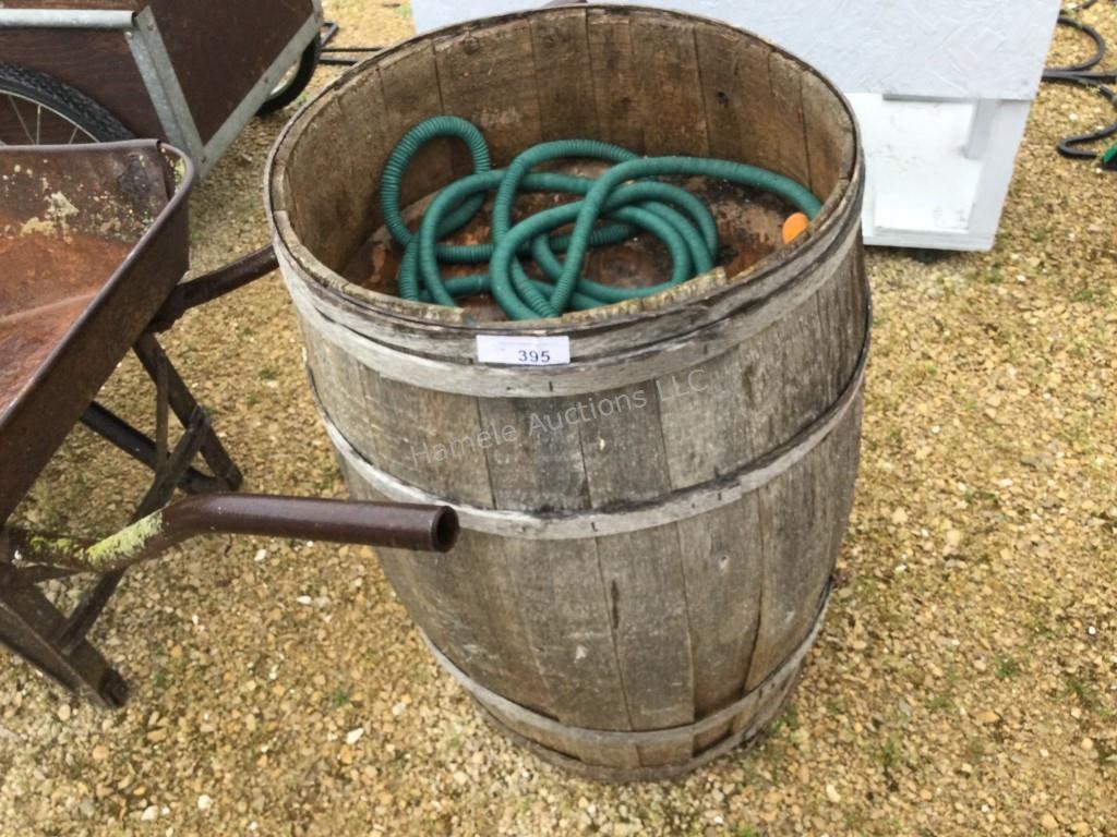 Vintage planter barrel and hose