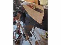 Small Evinrude 9.5 HP outboard motor with stand