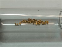 OF) gold flakes in vial