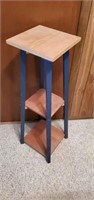 Navy blue tiered wooden stand